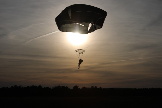 A U.S. Army paratrooper navigates Sicily Drop Zone to a safe landing at Fort Bragg, N.C., Dec. 3, 2020, during non-tactical airborne operations hosted by the U.S. Army Reserve's U.S. Army Civil Affairs and Psychological Operations Command (Airborne) and the 82nd Airborne Division.