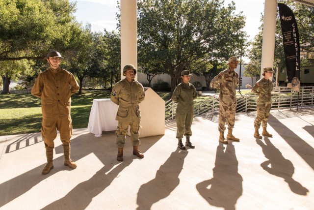 Five trainees assigned to the 264th Medical Battalion, 32d Medical Brigade, provided a living display of historical uniforms.  Privates Salvador Mendez, Christopher Arana, Bhumika Kharkiv, Isaiah Green and Kaitlyn Thompson donned period costumes, provided by Robert Ampula, AMEDD Center of History and Heritage, that spanned the last 100 years. 

MEDCoE Centennial Book Launch. Hosted by MG Dennis P. LeMaster, U.S. Army Medical Center of Excellence, Commanding General. AMEDD Museum-Vehicle Pergola, 3988 Stanley Road, Bldg. 1046, JBSA-Fort Sam Houston, Texas, 30NOV2021. (U.S. Army photo by Francis S. Trachta/Released)