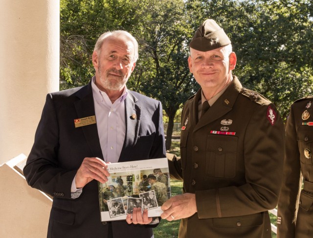 During the ceremony, personalized copies of the book were presented to the youngest Soldier, Pvt. Bright Odura, a 17-year-old 68W Combat Medic in training; James Murray, the Civilian employee with the most years in service; and Joseph Bray, the...