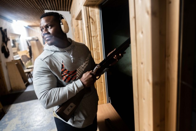 A hunter trainee speaks with an instructor during a hunting course.