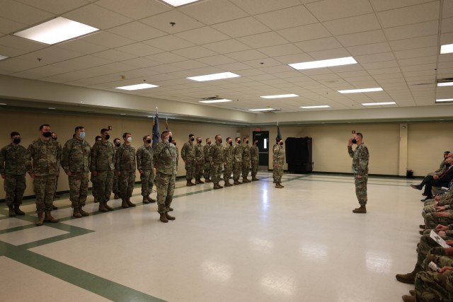FORT GEORGE G. MEADE, Md. – Lt. Col. David Garner, commander of Task Force Echo V and the 123rd Cyber Protection Battalion, salutes Col. Matthew Lennox, commander of the 780th Military Intelligence Brigade (Cyber), signifying his battalion's transition of the Task Force Echo Mission in a ceremony at Smathers Reserve Center, December 1.