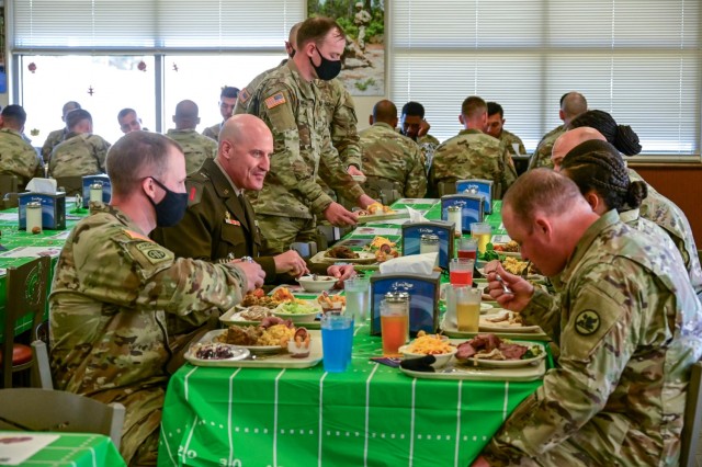 Brig. Gen. Patrick R. Michaelis, Fort Jackson commander, sits down for a meal with drill sergeant candidates at the U.S. Army Drill Sergeant Academy dining
facility Nov. 24. Each year across the Army leaders serve Thanksgiving meals to their Soldiers.