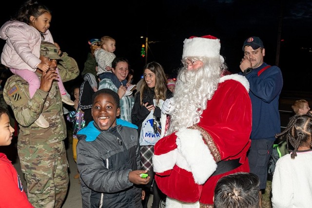Children shout for joy after meeting Santa Claus at the 2019 holiday tree lighting.