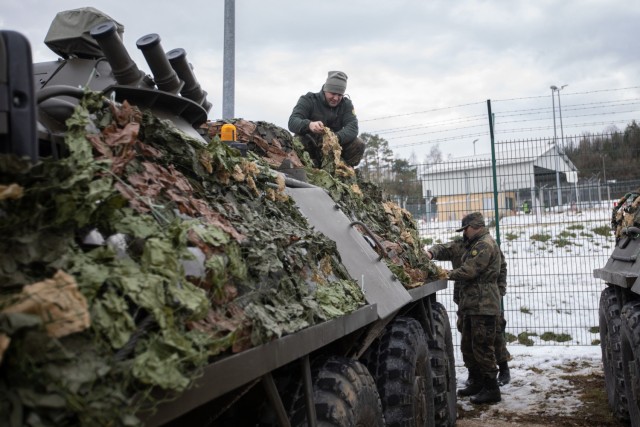 Soldiers with the 38th Mechanized Battalion, Bulgarian Land Forces, apply camouflage to their BTR-60 armored personnel carriers, as they prepare for the field portion of Combined Resolve XVI at the Joint Multinational Readiness Center in Hohenfels, Germany, Dec. 1, 2021. Several U.S. allied and partner nation militaries are involved in CBR XVI, and their participation makes the exercise an excellent opportunity to further develop and refine procedures for command and control across multinational formations.  Combined Resolve XVI includes approximately 4,600 soldiers from Bulgaria, Georgia, Greece, Italy, Lithuania, Poland, Serbia, Slovenia, Ukraine, United Kingdom, and the United States. The operations are being conducted by integrated battalions with multinational units operating under a unified command and control element allowing the U.S., its allies and partners to experience invaluable training alongside each other.