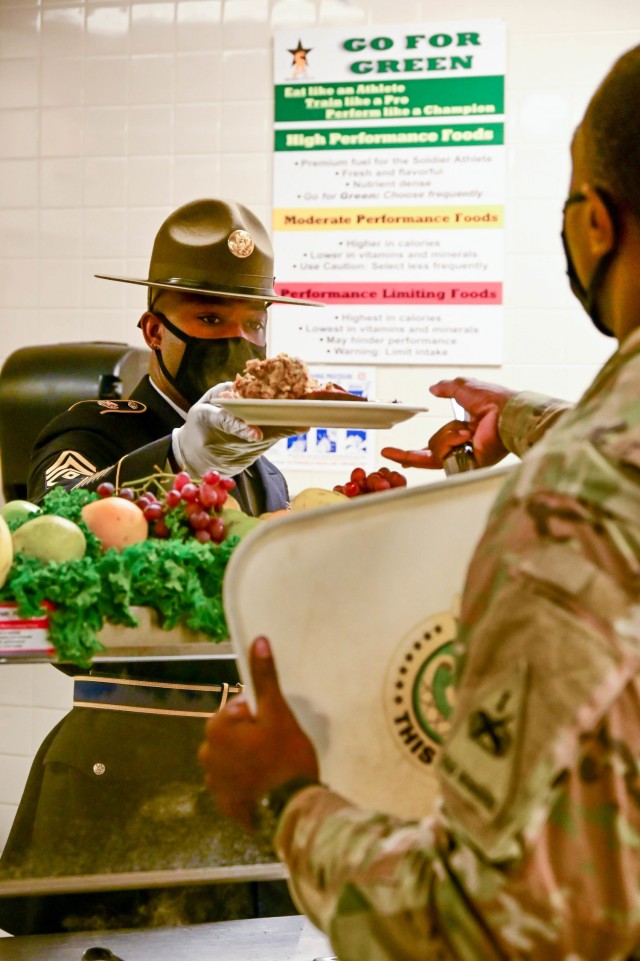 A drill sergeant leader at the U.S. Army Drill Sergeant Academy serves a Thanksgiving meal Nov. 24.