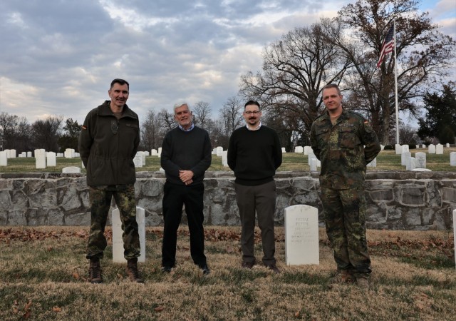 German Army liaisons Sgt. Maj. Kay Wittmann and Lt. Col. Siegfried Balk are joined by Fort Knox Cultural Resources manager Criss Helmkamp and historic preservation specialist Matthew Rector during their visit to the Fort Knox Main Post Cemetery Dec. 1, 2021.