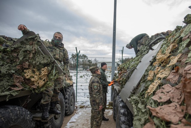 Soldiers with the 38th Mechanized Battalion, Bulgarian Land Forces apply camouflage to their BTR-60 armored personnel carriers, as they prepare for the field portion of Combined Resolve XVI at the Joint Multinational Readiness Center in Hohenfels, Germany, Dec. 1, 2021. Several U.S. allied and partner nation militaries are involved in CBR XVI, and their participation makes the exercise an excellent opportunity to further develop and refine procedures for command and control across multinational formations. Combined Resolve XVI includes approximately 4,600 soldiers from Bulgaria, Georgia, Greece, Italy, Lithuania, Poland, Serbia, Slovenia, Ukraine, United Kingdom, and the United States. The operations are being conducted by integrated battalions with multinational units operating under a unified command and control element allowing the U.S., its allies and partners to experience invaluable training alongside each other.