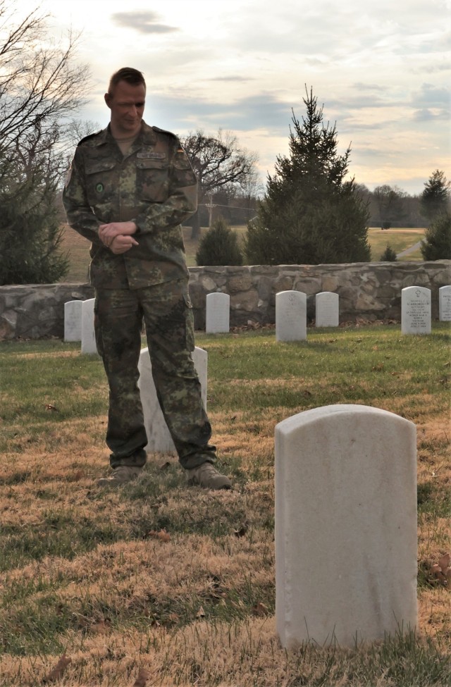 German Army liaison Sgt. Maj. Kay Wittmann stands, overlooking one of his countrymen’s graves in Fort Knox’s Main Post Cemetery at Fort Knox Dec. 1, 2021. In all, 17 German POWs are buried at Fort Knox.