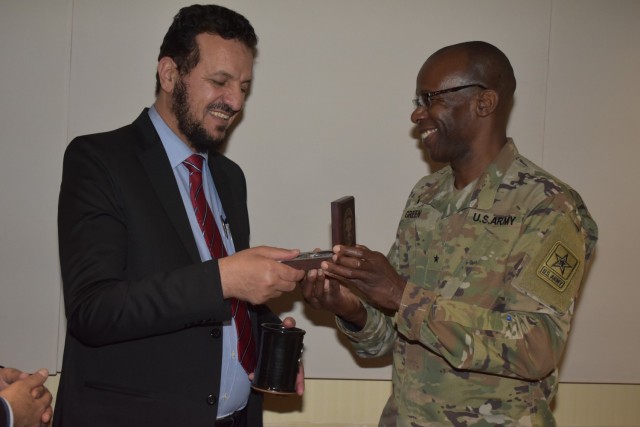 Deputy Chief of Chaplains, Chap. (Brig. Gen.) Bill Green exchanges gifts with Saudi Arabian Assistant General Director of the General Administration of Religious Affairs, Maj. Gen. Musfer Hassan M. Alqahtani after their lunch meeting on Nov. 30. (By Mel Slater)
