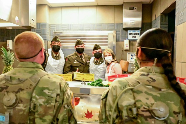 From left: Command Sgt. Maj. Anthony J. Wilson, Soldier Support Institute senior enlisted leader, Brig. Gen. Patrick R. Michaelis, Fort Jackson commander and Col. Stephen Aiton, SSI commander, and Becky Aiton pose after serving meals to Soldiers.