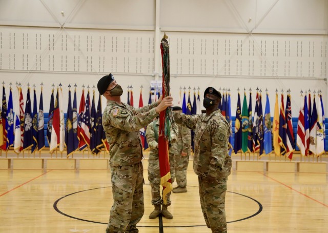 The 53rd Transportation Battalion (Movement Control) command team of Lt. Col. Aaron Cornett and Command Sgt. Maj. LaVaughn Brown uncase the battalion&#39;s colors, signifying the unit&#39;s activation during a ceremony at Joint Base Lewis-McChord, Dec. 3, 2021.  The unit joins the 593rd Expeditionary Sustainment Command after transitioning from Joint Base Eustis-Langley.  

The 53d Movement Control Battalion was first activated May 28, 1943 as Headquarters and Headquarters Detachment, 53d Quartermaster Truck Battalion, and it was activated again in North Africa June 22, 1943.

The battalion served in seven campaigns during World War II, including:
Sicily (with Arrowhead), Naples-Foggia, Anzio (with Arrowhead), Rome- Arno, Southern France (with Arrowhead), Rhineland, and central Europe.

With the advent of the Global War on Terrorism in 2001, the battalion has experienced a near constant rotation of units into and out of the CENTCOM area of responsibility with the headquarters and subordinate units deploying to Afghanistan, Iraq, and Kuwait as part of Operation Enduring Freedom, Iraqi Freedom, and New Dawn.  

Through a multitude of in-activations, re-designations, and re-activations the 53d Transportation Battalion has marched through the decades to its re-organization, Oct. 29, 1999, at Fort McPherson, Georgia, into the 53d Movement Control Battalion. The battalion most recently deployed out of Fort Eustis, Virginia, in support of Atlantic Resolve and the European Deterrence Initiative. 

Now that the mission is complete in support of Atlantic Resolve, the battalion re-stationed in August to Joint Base Lewis- McChord, activating as the Transportation Battalion (Movement Control) and stands ready to provide superior support to America&#39;s First Corps.

(U.S. Army photo by Sgt. 1st Class Tony White, 593rd Expeditionary Sustainment Command)