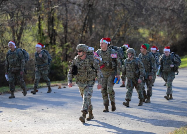 FORT KNOX, Ky. - V Corps Soldiers march to donate toys at a local Red Cross on Fort Knox, Kentucky, Dec. 2. Dozens of V Corps Soldiers attended a ruck march toy drive to boost holiday spirit and spread cheer to families and children in need in the local community. (U.S. Army photo by Pfc. Devin Klecan/released)