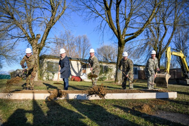 Leaders from the U.S. Army Garrison Italy and the Italian Veneto region take part in a ceremonial groundbreaking for Vicenza's Army Family Housing construction program in Vicenza, Italy, Dec. 6, 2021. Vicenza's construction program is the Army’s current largest housing investment program valued at $373 million. (U.S. Army photo by Maria Cavins)