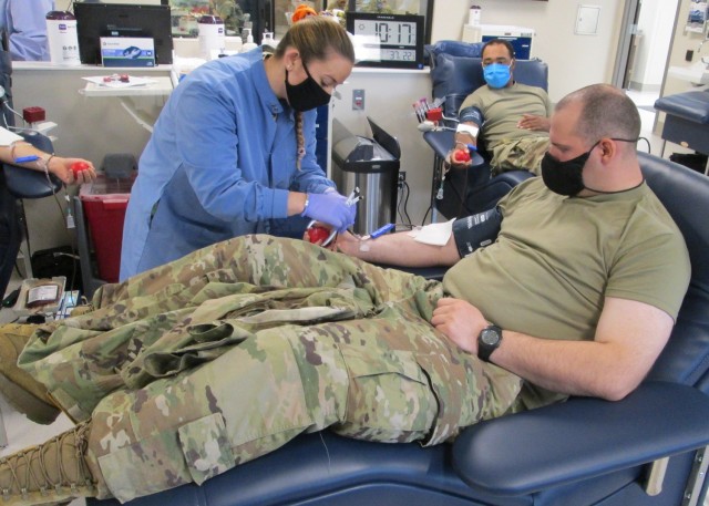 Ashley Gerstenberger, Fort Leonard Wood Blood Donor Center phlebotomist, prepares Pvt. David Brigaman, Company A, 35th Engineer Battalion, to donate blood Oct. 25. Alpha Company donated 96 units throughout the day, earning them the No. 10 spot on the all-time single-day donations list. 