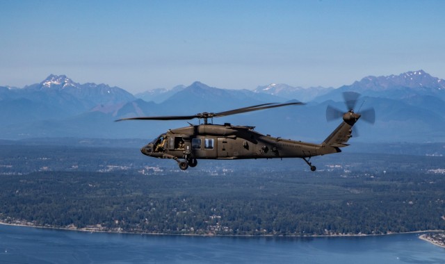 An all-female flight crew assigned to 16th Combat Aviation Brigade, flies along the coast over Puget Sound, Wash., on Jul. 29, 2021.  Flight crews comprising of all women are uncommon due to the low number of females in Army aviation. (U.S. Army photo by Capt. Kyle Abraham, 16th Combat Aviation Brigade)
