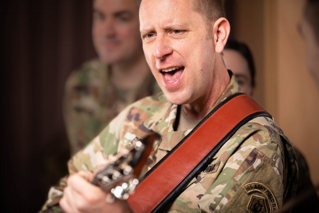 Sgt. 1st Class Brandon Boron performs with the Army Field Band musical group the Sixth-String Soldiers. Boron said his musical influences include Kris Kristofferson. 