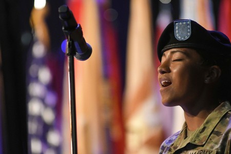 Army Pvt. Kelice Hines sings the national anthem during a change of command ceremony at Fort Lee, Va., June 23, 2021.