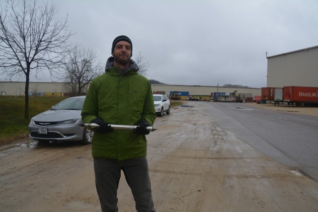 Greg Wachman, U.S. Army Corps of Engineers, St. Paul District senior geotechnical engineer, holds the cone for a cone penetrometer test, in Arcadia, Wisconsin, Nov. 12.