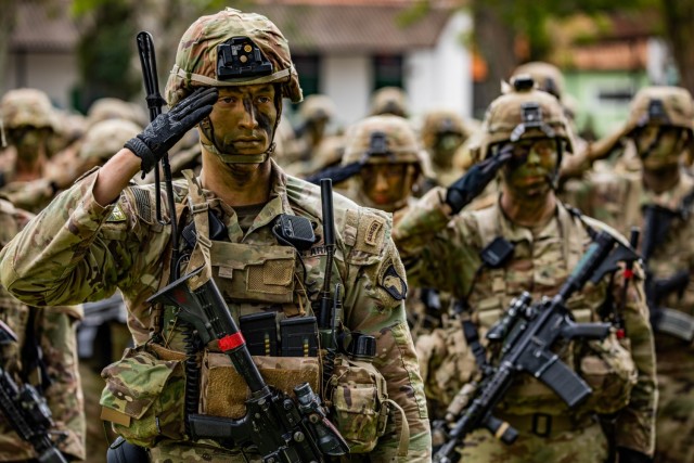 U.S. Army Soldiers assigned to Bravo Company, 1st Battalion, 187th Infantry Regiment, 3rd Brigade Combat Team (Rakkasan), 101st Airborne Division (Air Assault) salute during the opening ceremony of Southern Vanguard 22 at the 5th Light Infantry Battalion in Lorena, Brazil, Dec. 6 2021. Southern Vanguard 22 was planned as a 10-day air assault operation and was the largest deployment of a U.S. Army unit to train with the Brazilian army forces in Brazil. (U.S Army photo by Pfc. Joshua Taeckens)
