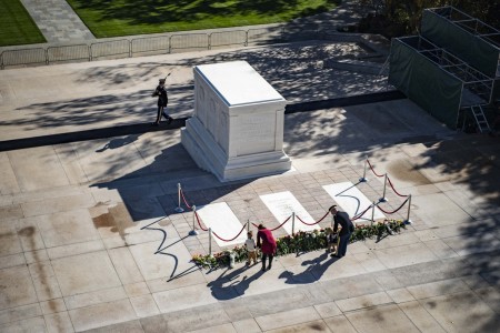 Visitors participate in the Tomb of the Unknown Soldier Centennial Commemoration Flower Ceremony at the Tomb of the Unknown Soldier at Arlington National Cemetery in Virginia, Nov. 9, 2021.