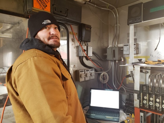 Ken Diediker, U.S. Army Corps of Engineers, Savannah District geologist, monitors the data collected from the cone penetrometer test in Arcadia, Wisconsin, Nov. 12.