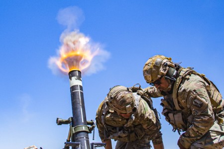 Army Col. Randy Lau fires a 120 mm mortar during a live-fire exercise at Camp Roberts, Calif., June 15, 2021.