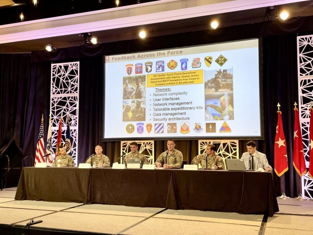 Maj. Todd Klinzing-Donaldson, third from right, the top network and communications officer for the "Spartan Brigade," 2nd Armored Brigade Combat Team, 3rd Infantry Division, speaks on the “Warfighter Perspective: Networking to Support the MDO Concept” panel at the "U.S. Army Technical Exchange Meeting 7: Delivering the Unified Network,” in Nashville, Tennessee, Dec. 2, 2021. The Spartan Brigade is the supporting unit for the Army’s upcoming ABCT On-The-Move network communications pilot and together with the 3rd ID Deputy Commanding General-Maneuver, Brig. Gen. Jasper Jeffers, first from left, who chaired the panel, provided feedback and insight to industry on pilot requirements and desired outcomes. (U.S. Army photo by Capt. Sean Minton)