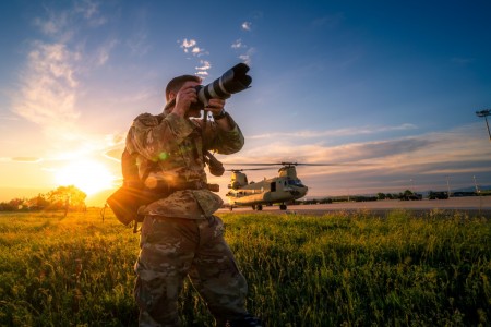U.S. Army Staff Sgt. Christopher Stewart, a public affairs mass communication specialist assigned to 7th Army Training Command, takes photos at the forward area re-arming and refueling point during 12th Combat Aviation Brigades air assault operations for Exercise Swift Response, part of DEFENDER-Europe 21, on May 7, 2021 in Bezmer, Bulgaria. 
