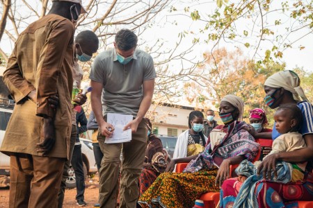 Army Staff Sgt. Aidan McNulty writes down a patient’s information during a medical clinic to serve the local population in Bobo-Dioulasso, Burkina Faso, Feb. 19, 2021. 