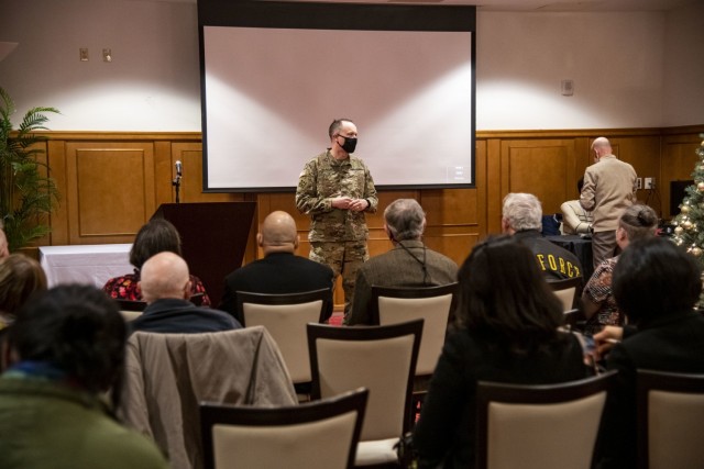 Col. Seth Graves, U.S. Army Garrison Humphreys commander, speaks with former U.S. Forces Korea service members visiting as part of the Republic of Korea Ministry of Patriots and Veterans Affairs Revisit Korea program before a windshield tour of Camp Humphreys Dec. 3, 2021.