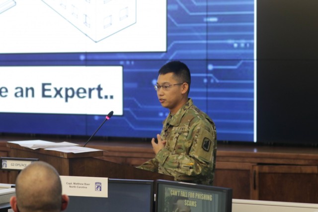 U.S. Army 2nd Lt. Christian Lance Relleve, an Army Reserve Officer assigned to the California-based 453rd Chemical Battalion, presents his idea to a panel of civilian and military experts during Dragon's Lair 6 at Fort Bragg, N.C., Dec 6.
