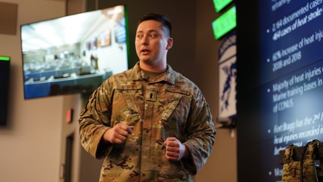 U.S. Air Force 1st Lt. Justin O’Brien assigned to 88th Air Base Wing located at Wright Patterson Air Force Base, Ohio, presents his idea for a battery-operated, water-cooled plate carrier system during Dragon's Lair, Dec 6. O'Brien's design helps keep servicemembers up to 30 degrees cooler in hot and humid conditions.