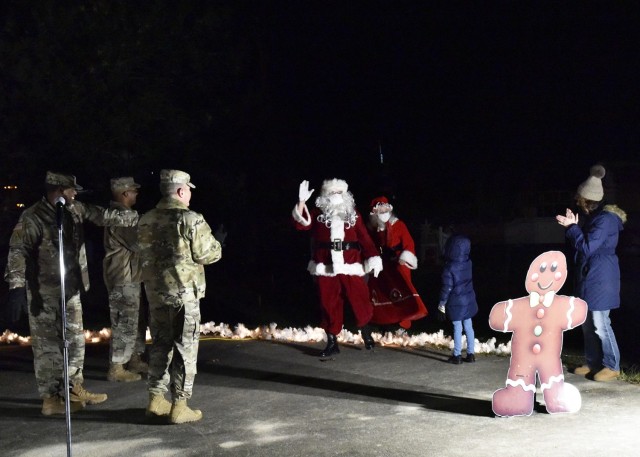 Mr. and Mrs. Santa Claus arrive at Joint Services Park Tuesday evening to help the U.S. Army Chemical, Biological, Radiological and Nuclear School leadership light the installation Christmas tree that signals the start of the holiday season at Fort Leonard Wood. 