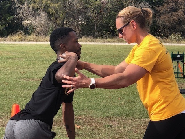 Sgt. Michael Vaughn learns the art of perfect form with Coach Adriane Wilson at training camp at Fort Bragg in North Carolina in November 2019. (Photo courtesy Adriane Wilson)