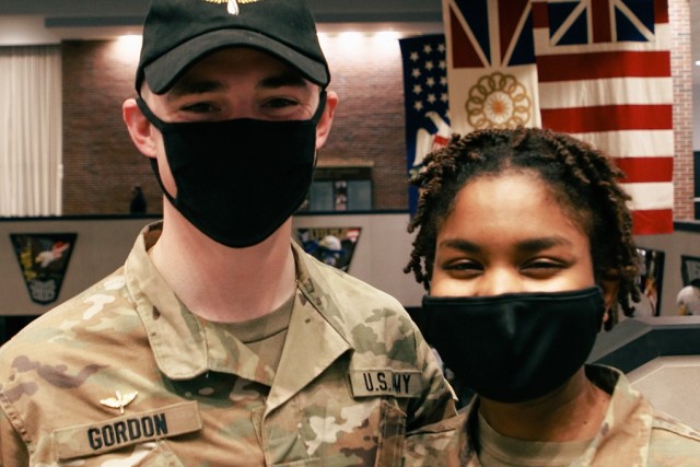 Class of 2022 Cadets John Gordon (left) and Cameryn Smith (right) pose for a photo after receiving their branch notification during Branch Night Dec. 2 at Eisenhower Hall Theatre.   (Photo by Delancey Pryor III/PV)