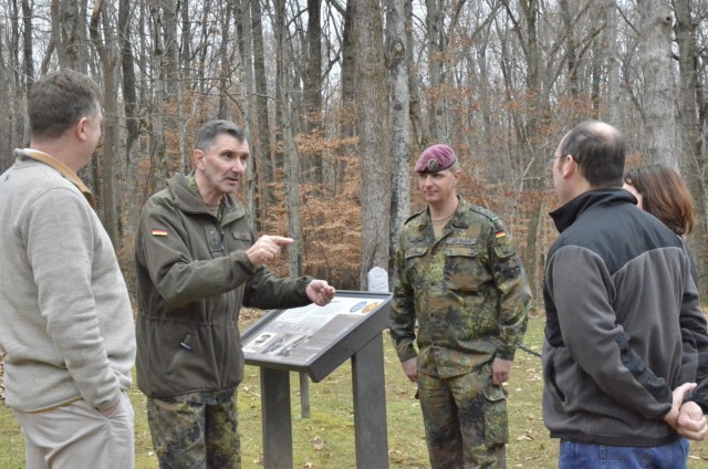 Lieutenant Colonel Siegfried J. Balk, German liaison officer, United States Army Maneuver Center of Excellence, and Sgt. Maj. Kay Jan Wittmann, German army liaison, MCoE, receive an update on Fort Campbell’s German POW cemetery Dec. 1 during a visit to Fort Campbell. Pictured are Karsten Haake, project director, Campbell Crossing, left; Balk; Wittmann; Ron Grayson, Cultural Resources Management Program manager, Fort Campbell Directorate of Public Works; and Nichole Sorensen-Mutchie, archaeologist, Cultural Resources Management Program, DPW.