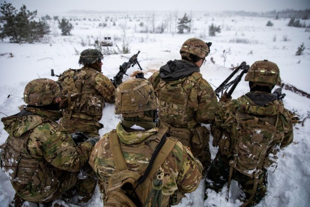 Soldiers with 3rd Battalion, 66th Armored Regiment (3-66), 1st Armored Brigade Combat Team, 1st Infantry Division conduct a multi-company live-fire exercise at Camp Ādaži, Ādaži, Latvia, Dec 3, 2021. The 3-66 is participating in Winter Shield 2021, an exercise that builds readiness, increases interoperability and enhances the bond between ally and partner militaries via participation in multinational training events. (U.S. Army photo by Spc. Michael Baumberger/RELEASED)