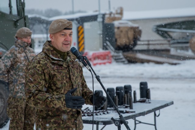 Latvian Land Forces Mechanized Infantry Brigade Commander Col. Sandris Gaugers speaks at the closing ceremony for Winter Shield 2021 at Camp Ādaži, Ādaži, Latvia, Dec. 4, 2021. Soldiers with 3rd Battalion, 66th Armored Regiment, 1st Armored Brigade Combat Team, 1st Infantry Division participated in the exercise and showcased what can be accomplished when allies are working alongside each other. (U.S. Army photo by Spc. Michael Baumberger/RELEASED)