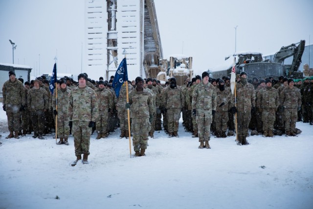 Soldiers with 3rd Battalion, 66th Armored Regiment (3-66), 1st Armored Brigade Combat Team, 1st Infantry Division stand in formation at the closing ceremony for Winter Shield 2021 at Camp Ādaži, Ādaži, Latvia, Dec. 4, 2021. Soldiers with 3-66 participated in Winter Shield 2021, a combined forces exercise that strengthens ties between NATO allies and partner nations through integrated training exercises. (U.S. Army photo by Spc. Michael Baumberger/RELEASED)