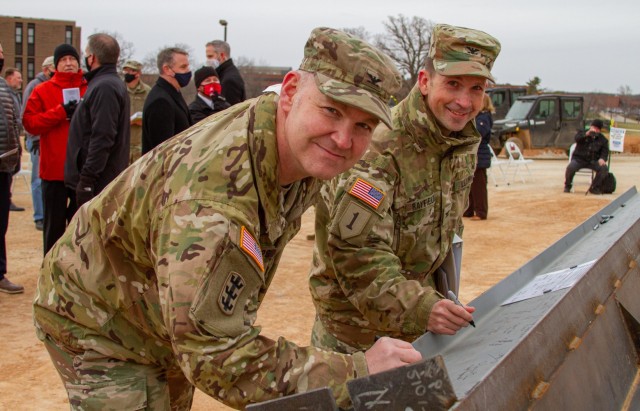 Northwestern Division Commander Col. Geoff Van Epps and Kansas City District Commander Col. Travis Rayfield sign the last piece of structural steel for the General Leonard Wood Community Hospital Project before a Topping Out Ceremony at Fort...