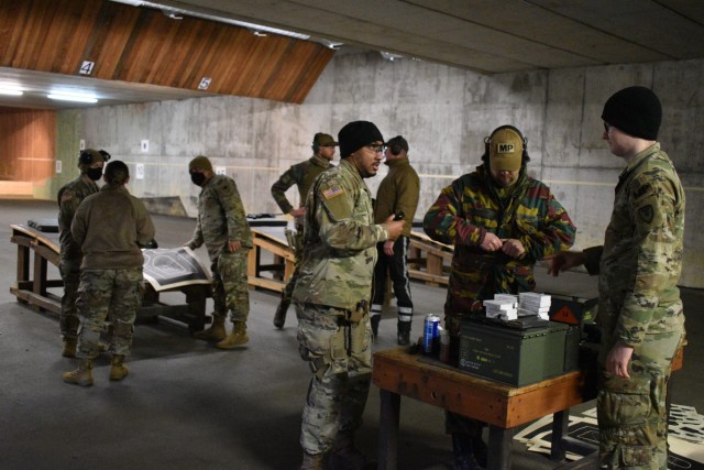 U.S. Army military police Soldiers helped their Belgian counterparts qualify on U.S. Army weapons Dec. 7 at a chilly shooting range at the Belgian military’s Peutie Military Complex in Vilvoorde, Belgium. (U.S. Army photo by Bryan Gatchell, USAG...