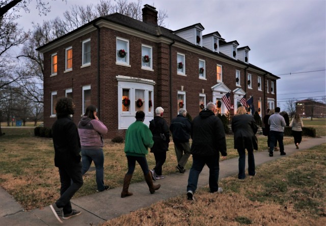 Participants in the Fort Knox 2021 Tour of Homes walk toward a historical Clarke neighborhood house before entering it for the tour.
