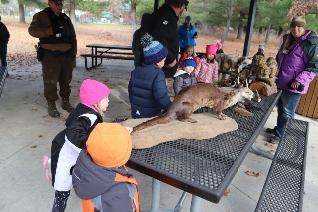 Children participating in the USO Wisconsin’s Hike and Hunt event Nov. 17, 2021, at Fort McCoy, Wis., look at taxidermy mounts that relate to animals of Wisconsin. The items were brought to the event by Natural Resources Specialist Kevin Luepke...