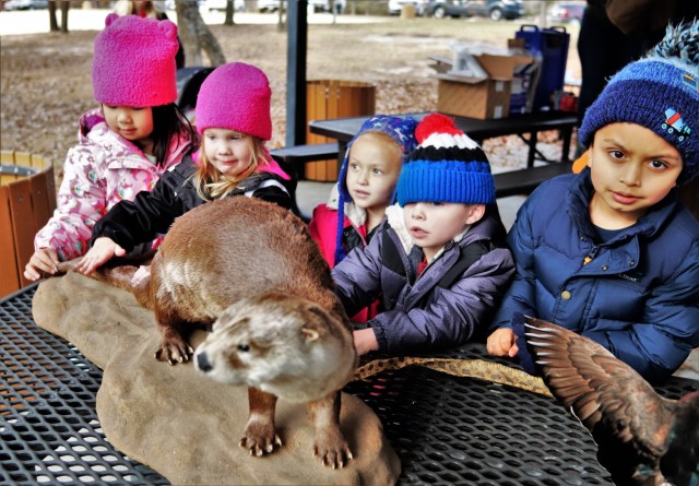 Children participating in the USO Wisconsin’s Hike and Hunt event Nov. 17, 2021, at Fort McCoy, Wis., look at taxidermy mounts that relate to animals of Wisconsin. The items were brought to the event by Natural Resources Specialist Kevin Luepke...