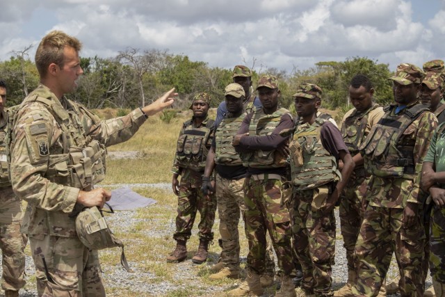 U.S. Army Sgt. Alexander Poling, squad leader, 1st Platoon, C Company, 1-102nd Infantry Regiment (Mountain), Task Force Iron Gray, Combined Joint Task Force – Horn of Africa (CJTF-HOA), instructs service members from the Kenya Defence Forces on...