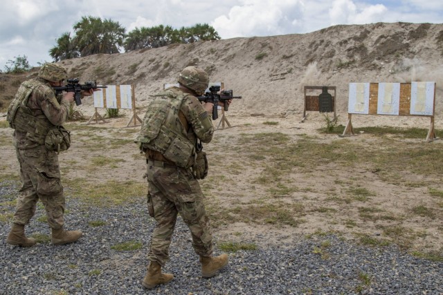 U.S. Army Soldiers assigned to C Company, 1-102nd Infantry Regiment (Mountain), Task Force Iron Gray, Combined Joint Task Force – Horn of Africa (CJTF-HOA), engage targets while moving during urban rifle marksmanship training with service...