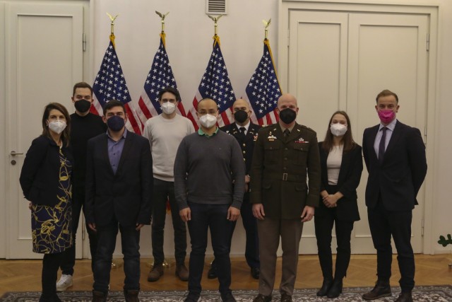 US Army Brigadier.  Gen. Joseph Hilbert, commander of the 7th Army Training Command, poses for a group photo with German university and post-graduate students, and staff from the United States Consulate General in Leipzig, after a discussion on December 6, 2021, at the US Consulate in Leipzig, Germany.  The students engaged Hilbert on a wide range of safety-related topics in an informal discussion. 