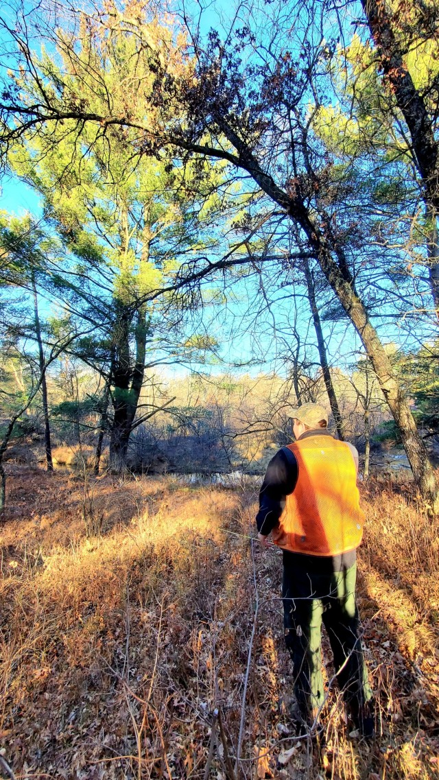 Forestry Technician Tim Parry with the Forestry Office of the Directorate of Public Works Environmental Division Natural Resources Branch takes measurements and more Dec. 2, 2021, while documenting the size of a large white pine tree located along...
