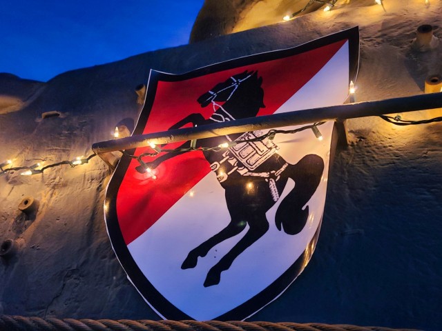 The Regimental Support Squadron, Packhorse logo is displayed on a historical 11th Armored Cavalry Regiment vehicle decorated for the season in Wickam Park, Fort Irwin, Calif., on December 8, 2021. Wickam Park is one of the locations in the Regiment's footprint that are dedicated to the preservation of history.