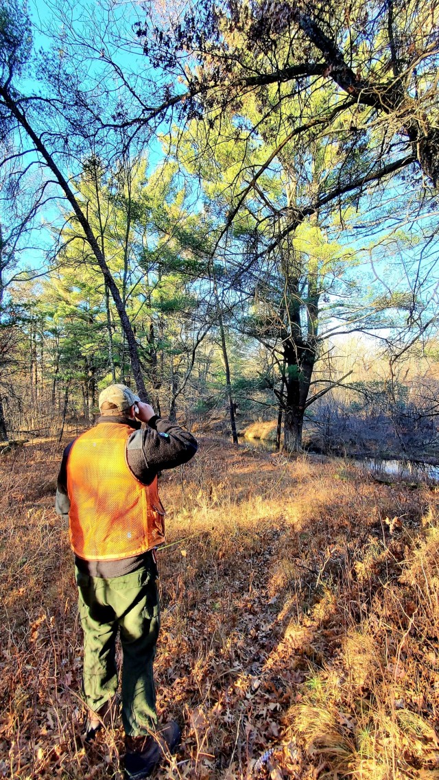 Forestry Technician Tim Parry with the Forestry Office of the Directorate of Public Works Environmental Division Natural Resources Branch takes measurements and more Dec. 2, 2021, while documenting the size of a large white pine tree located along...